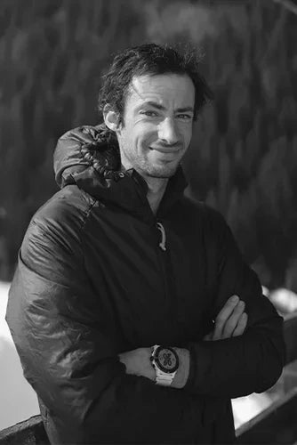 Kilian Jornet posing with his COROS GPS watch in black and white