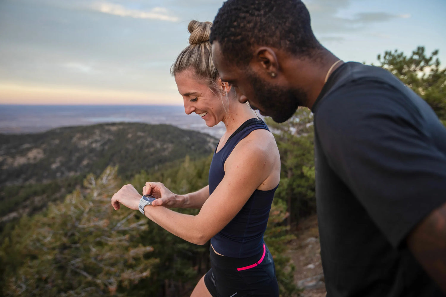 two people looking at a coros watch